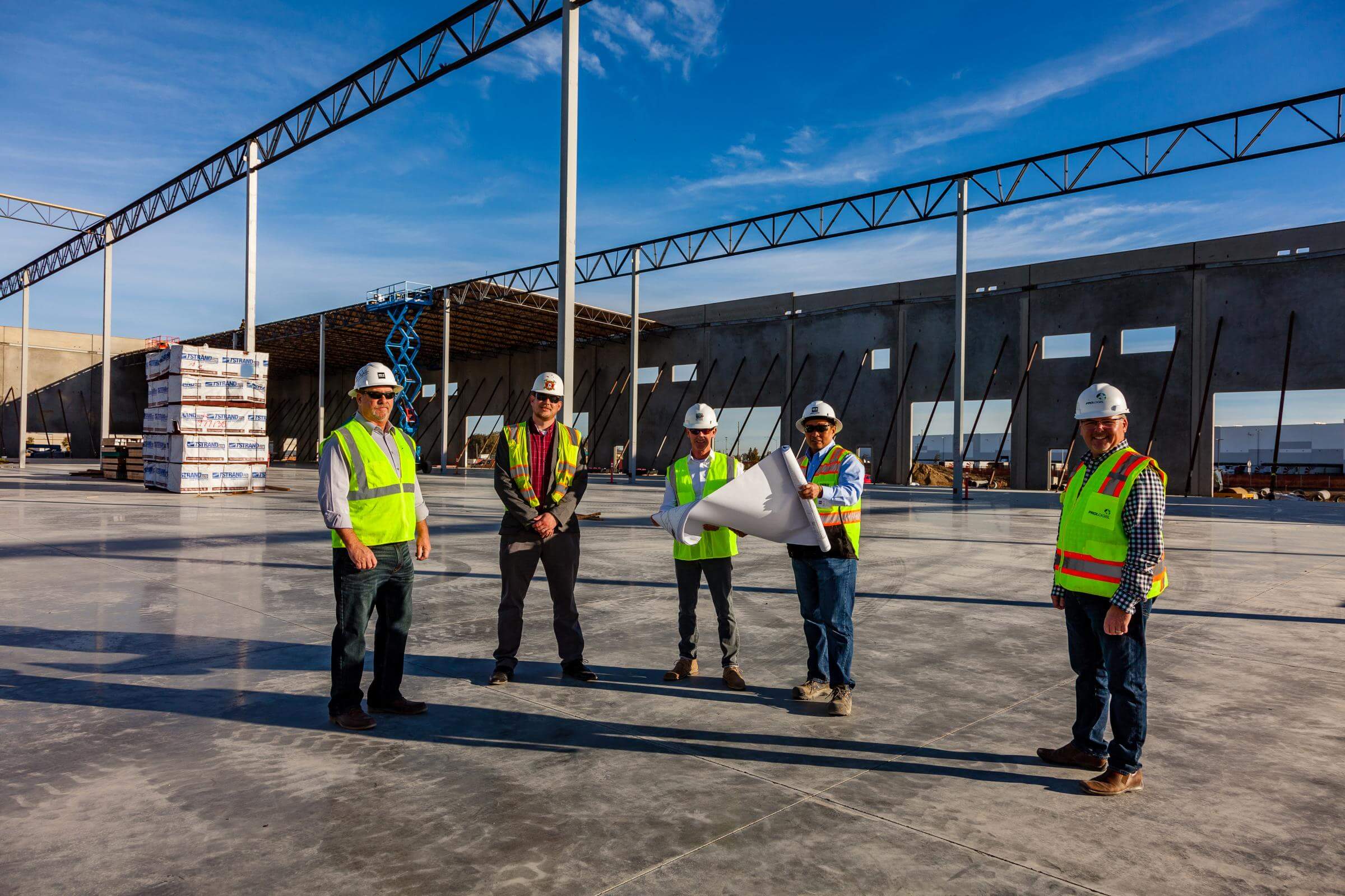 Men looking at plans on a construction site.