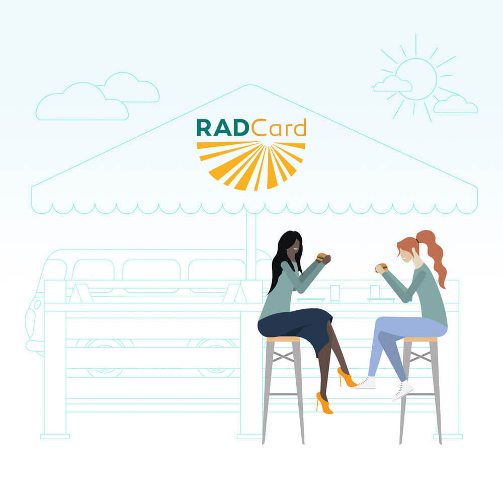 RAD Card Program Logo Above Two Women At a local Cafe.