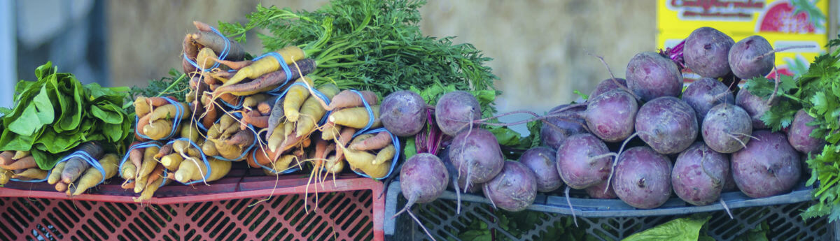 Close up of carrots and turnups at a street fair