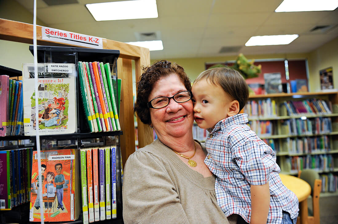 Child and Adult in a Library